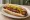 Ripper Hot Dog: an illustration of pork and mustard on hot dog bun.