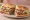 Roast Beef Hero: an illustration of beef, horseradish, mayonnaise, lettuce and more on hoagie roll.