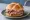 Roast Beef Sandwich: an illustration of beef and horseradish on kaiser roll.