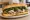 Roast Pork Italian: an illustration of pork, provolone, broccoli rabe and garlic on hoagie roll.