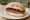 Roll and Sausage: an illustration of pork, sausage and brown sauce.