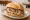 Rollbraten Brötchen: an illustration of pork, beef and mustard on kaiser roll.