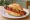Rote Wurst: an illustration of sausage, paprika and mustard on kaiser roll.