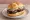 Rotwurst Brötchen: an illustration of mustard on kaiser roll.