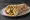 Sabich b'Lafa (סביח בלאפה): an illustration of eggplant, egg, hummus, tahini and more.