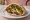 Sabich Charif (סביח חריף): an illustration of eggplant, egg, hummus, tahini and more on pita.