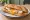 Sahanda Yumurta Ekmek: an illustration of egg, butter and pepper on bread.
