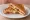 Salamlı Tost: an illustration of salami, cheese and butter on bread.