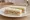 Salmon and Cucumber: an illustration of salmon, cucumber, butter, dill and more on white bread.
