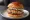 Salmon Burger: an illustration of salmon, egg, dill, caper and more.