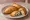 Sambousek Jibneh (سمبوسك جبنة): an illustration of cheese and parsley.