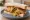 Samosa Sandwich: an illustration of butter, potato, lamb, chicken and more on white bread.