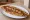 Samsun Pidesi: an illustration of beef, onion, tomato, pepper and more on pita.