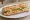 Sandwich à Emporter: an illustration of ham, butter, cheese and lettuce on baguette.