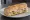 Sandwich Aéroport: an illustration of ham, tuna, butter, cheese and more on baguette.