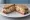 Sandwich Alsacien: an illustration of pork, sauerkraut, mustard, onion and more.
