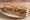 Sandwich Andouille de Vire: an illustration of pork on baguette.