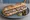 Sandwich Andouille de Vire: an illustration of butter, pork, mustard and pickle on baguette.