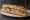 Sandwich au Jambon Persillé: an illustration of ham, pork, parsley and butter on baguette.