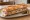 Sandwich au Pâté: an illustration of pork, butter and pickle on baguette.