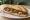 Sandwich aux Champignons: an illustration of mushroom, butter, garlic and parsley on baguette.