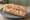 Sandwich aux Fruits de Mer: an illustration of shrimp, crab, mayonnaise, lemon and more on baguette.