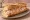 Sandwich aux Fruits de Mer: an illustration of shrimp, crab, fish, mayonnaise and more on baguette.