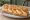 Sandwich aux Quenelles: an illustration of fish and butter on baguette.