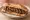 Sandwich Bœuf Bourguignon: an illustration of beef, onion, carrot, mushroom and more on baguette.