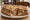 Sandwich Baeckeoffe: an illustration of beef, pork, lamb, potato and more on baguette.
