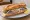 Sandwich Boulonnais: an illustration of herring, butter, onion, pickle and more on baguette.