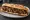 Sandwich Bourguignon: an illustration of beef, onion, mushroom, carrot and more on baguette.