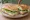 Sandwich Boursin: an illustration of cucumber, lettuce, garlic, parsley and more on baguette.