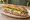 Sandwich Brie-Jambon: an illustration of ham, brie, butter, lettuce and more on baguette.