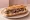 Sandwich Brocciu-Figatellu: an illustration of onion and pepper on baguette.