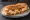 Sandwich Camembert Rôti: an illustration of butter, walnuts, honey and pepper on baguette.