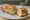 Sandwich Cancoillotte: an illustration of butter, garlic and pepper on baguette.
