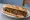 Sandwich Carbonnade: an illustration of beef, onion, mustard, butter and more on baguette.