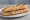 Sandwich Charentais: an illustration of ham, butter, pickle and pepper on baguette.
