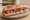 Sandwich Corse: an illustration of capicola and butter on baguette.