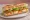 Sandwich Crudités: an illustration of egg, lettuce, tomato, carrot and more on baguette.