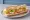 Sandwich Crudités: an illustration of egg, lettuce, tomato, cucumber and more on baguette.