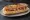 Sandwich Dauphinois: an illustration of ham and butter on baguette.