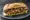 Sándwich de Bondiola: an illustration of chimichurri, lettuce and tomato on baguette.