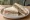 Sándwich de Cabeza de Jabalí: an illustration of ham, butter and mustard on white bread.