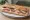 Sandwich de Chantier: an illustration of ham, cheese, butter and pickle on baguette.