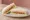 Sándwich de Confitería: an illustration of ham, cheese, butter, lettuce and more on white bread.