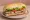 Sándwich de Matambre: an illustration of lettuce, tomato and mayonnaise on baguette.