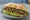 Sándwich de Matambre: an illustration of chimichurri, lettuce and tomato on baguette.
