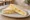 Sándwich de Miga de Ananá y Queso: an illustration of pineapple, cheese, butter and mayonnaise on white bread.